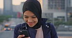 Phone, student and Muslim woman in city, smile or check post for education course on internet. Mobile, reading and Islamic person outdoor with academic app, scholarship review and text with wind