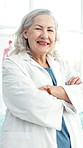 Face, doctor and woman in clinic with arms crossed, medical expertise and healthcare professional. Portrait, mature or specialist with confidence for cardiology knowledge, health service or smile