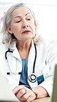 Laptop, paperwork or doctor on video call for medical report, patient history or update. Online consultation, healthcare worker or mature woman with computer document for telehealth records in clinic