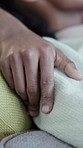 Hands, relax and couple on couch with love, affection and bonding together in living room. Black people, rest and cuddle at house with trust, romantic partner and healthy relationship for commitment