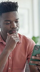 Reading, thinking and black man with phone on couch, message reflection and response idea for chat. Texting, home and male person with mobile for digital communication, social media and meme decision