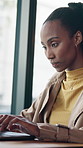 Coffee shop, typing and black woman on laptop for remote work, email communication and internet. Freelancer, restaurant and person on computer for online proposal, research and website in cafeteria