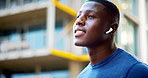 Earphones, fitness and black man in city with music, podcast or playlist for runner, exercise or wellness. Audio tech, athlete and male person listening to album or radio for cardio workout in town.