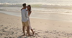 Hug, love and couple by beach on holiday, getaway or weekend trip in summer together. Happy, care and man embracing woman for vacation with support in marriage, romance or anniversary by ocean.
