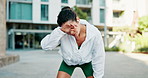 Tired, woman and fitness with sweat in town for workout break, rest or outdoor exercise. Exhausted, female person or runner catching breathe for intense training, cooldown or recovery in urban city