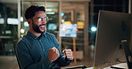 Night, businessman or winning with fist pump on computer for promotion or bonus in office. Excited, man or employee with smile or celebration in evening for business success or good news in workplace