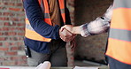 People, architect and handshake at site for meeting, introduction and construction agreement. Team, shaking hands and welcome with respect, partnership and maintenance deal for building development