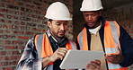 Tablet, men and construction workers on site for planning in collaboration with architecture. Discussion, digital technology and male civil engineers with research for building, maintenance or repair