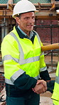 Architect, handshake and mature man for construction collaboration, renovation or team. Happy, civil engineer or people in partnership for real estate, project management or onboarding introduction