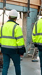 Architect, construction site and men for urban planning, walking or meeting for decision. Inspection, property and contractor with project management for civil engineering or building development