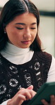 Review, scroll or Asian woman with tablet in agency, editing draft or newsletter for email marketing. Reading, tech or person with brand feedback for promotional bulletin, check grammar or guidelines