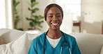 Happy, black woman and face of nurse in home with confidence for career in medical service. Smile, about us and portrait of female caregiver on sofa in living room with pride for community nursing.