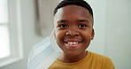 Face, kid and remove mask in home for post illness recovery, infection control and safety. Happy, black child and take off protection in house for viral clearance, healing or end of respiratory virus