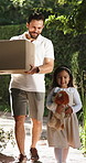 Dad, child and walking with box for surprise, logistics or delivery to new home or relocation. Father, daughter or kid with courier parcel, package or stuffed animal for moving or arrival together
