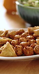 Food, samosa or plate with Indian cuisine in home for middle eastern dish or Arabian meal on table. Empty, platter or meat balls with pastry snacks for cultural gathering or eating tradition in house