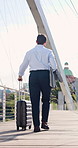 Back, businessman and walk in city with suitcase, international work trip and travel for company. Employee, person and entrepreneur on bridge with luggage, journey and commute for job in urban town.
