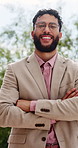 Face, businessman and smile in city with arms crossed for pride, real estate job and career growth. Bokeh, happy person or realtor outdoor with glasses, about us or confident for property development