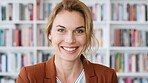Happy, professor and face of woman in library for about us, course lecturer and knowledge. Education, academy researcher and bookshelf with person on campus for pride, teacher and university advisor