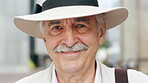Happy, travel and face of old man in city for tourism, weekend break and retirement holiday. Explore, smile and confidence with portrait of senior person outdoor for vacation, relax and getaway