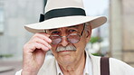 Glasses, travel and face of old man in city for tourism, weekend break and retirement holiday. Explore, lens and confidence with portrait of senior person outdoor for vacation, relax and getaway
