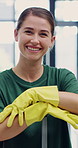Janitor, woman and face in office with hygiene service, arms crossed and smile for disinfection. Portrait, gloves and cleaner person for sanitation, maintenance and management for wellness or safety