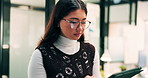 Woman, research and scroll in office with tablet, check marketing insights and review online campaign. Asian person, reading and glasses in agency with tech, advertising and brand awareness project.