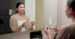 Pregnancy, test and mirror with asian woman in bathroom for ovulation, hormone level or waiting. Reproduction kit, fertility screening and hcg check with person in home for nervous for results