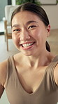 Selfie, fitness and face of asian woman in home for yoga influencer, social media or picture. Pilates post, photography pov and wellness vlogger with person in living room of apartment for peace sign