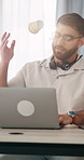 Man, laptop and stress with coffee for remote work from home with headset, mistake or glitch. Person, virtual assistant and frustrated with computer, error and throw cup with typing at apartment