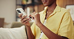 Phone, scrolling and hands of woman in home with networking, communication or texting on app. Technology, online and female person with cellphone for chatting, research or email in living room.