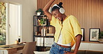 Music, dance and excited black woman in apartment with energy, streaming service and favorite song. Headphones, funny person and moving in home, radio or listening to audio for freedom on weekend