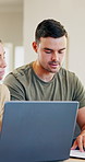 Couple, laptop and discussion with documents for finance, bills and planning with taxes in home. Computer, man and woman with stress for budget, debt and asset management for mortgage payment