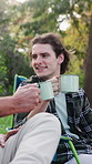Man, happy and toast with coffee for camping, bonding and relax in nature environment to celebrate. Friends, bottle and cheers with beverage on holiday, vacation or trip in woods with joke and laugh