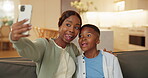 Selfie, mother or child in house with fun, playful picture or bonding post on weekend break. Digital, connection or black family with tongue out, funny face or memory capture for social media.

