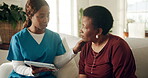 Woman, nurse and consulting with tablet on sofa for test results, medical diagnosis and support. Black people, mature patient and caregiver with tech in home for health advice, care plan or follow up