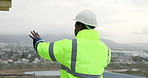 Man, architect and phone call on construction site for planning, compliance update and renovation. Engineer, back of person and tech on worksite for project feedback, talk and explaining extension