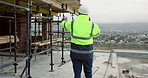 Man, foreman and phone call on construction site for planning, compliance update and renovation. Engineer, back of person and tech at scaffolding for project feedback, talk and explaining extension