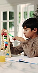 Homework, child and counting on abacus in home for mental math, problem solving and learning. Education, workbook and kid with bead calculation for number practice, school assignment and development