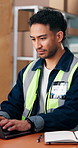 Man, typing and logistics in warehouse with laptop, track delivery app and reading email from courier. Supply chain, person and check computer to monitor shipping, supplier order and dispatch update.