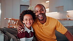 Face, hug and son laughing with father on sofa in home living room for bonding or security. African family, happy and single parent man embracing boy child in apartment for connection or safety