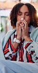 Sick, tissue and woman in lounge with blowing nose, flu season or illness symptoms with hayfever. Health, sinus issue or person in home with paper napkin, germ infection or congestion with allergies
