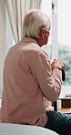 Thinking, home and senior man with walking stick, wellness and pensioner with hearing aid for sound. Lonely, reflection and elderly person with disability on bed, back and audio implant in house