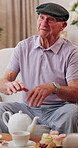 Happy, talking and visit with old man in house with tea party, communication and bonding over cake. Senior person, retirement and relax on living room couch for brunch, dessert or friendly chat