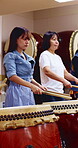 Taiko, women or group with drums in studio for cultural rehearsal, learning choreography or harmony. Bachi percussion, japanese band and sound for coordination, performance practice or timing rhythm