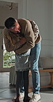 Happy, home and child hug dad for love, welcome and greeting for arrival, entrance or return. Man, girl or daughter with connection in family house with trust, care or reunion for safety and security