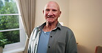 Wellness, face and old man in home with good mood, positive attitude and optimistic for weekend break. Wellbeing, smile or elderly person with portrait, happy moment and satisfaction in retirement.