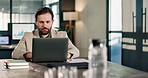 Corporate, man and reading in office with laptop, research and data analysis for finance report. Serious, male person or review in workplace with pc, financial audit and statistics for company profit