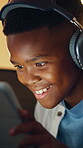 Success, headphones or child on sofa with tablet, night activity or winner in online game. Victory, evening or black boy in home with fist pump, best score or achievement in digital competition.