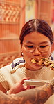 Couple, eating and asian woman with skewer for japanese cuisine, travel or recipe together. Man, stick or feeding female person with kebab or street food for meal, snack or dining in town market