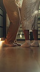 Love, couple or legs in kitchen with dance, romantic moment or bonding together on weekend break. Fun, flare or people in house with movement, rhythm or playful connection in healthy relationship.